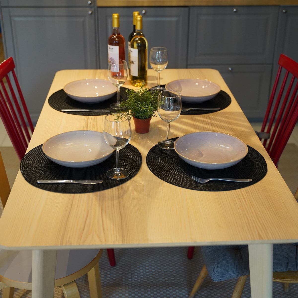 Set dining table with plates and wine glasses